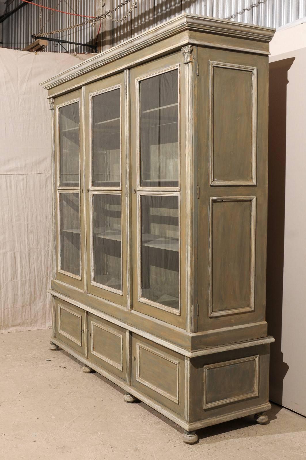French 19th Century Wood Cabinet with Three Glass Doors Raised on Round Feet In Good Condition In Atlanta, GA