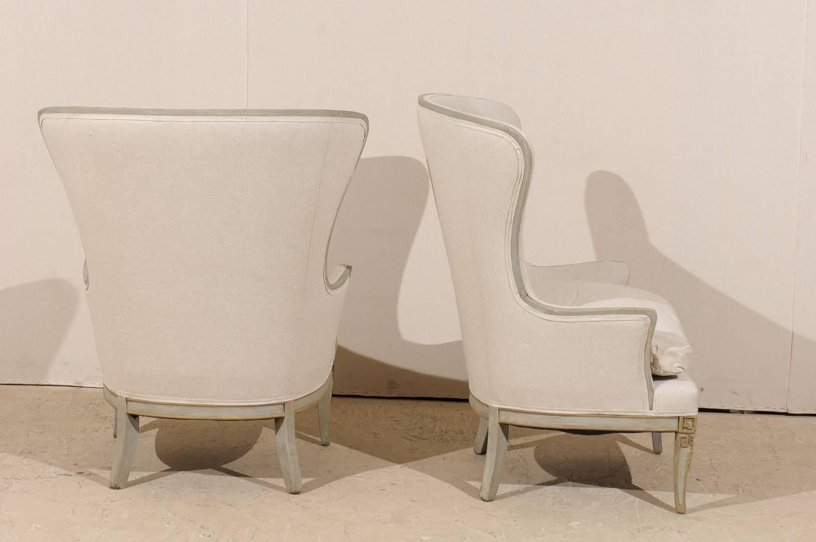 American Pair of Painted Wood Wingback Chairs with Carved Details and New Upholstery
