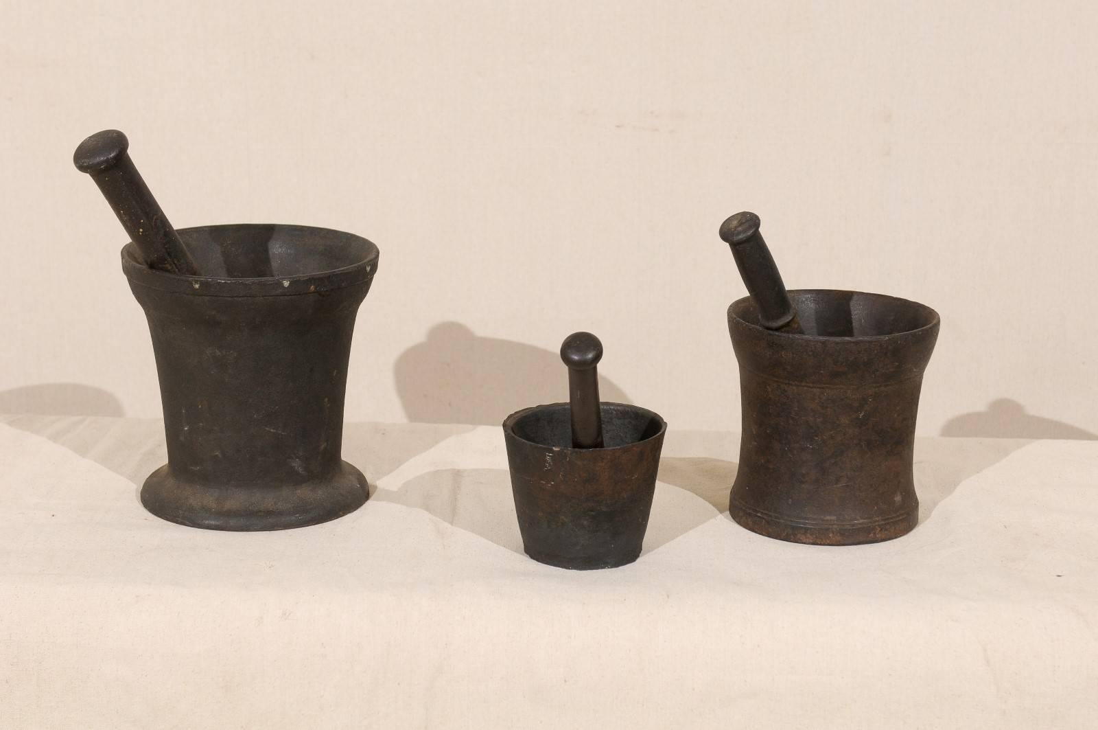 English Set of Three Mortar and Pestles with Nice Weight, Black Color and Varying Sizes