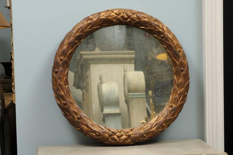 Garland Mirror with Gilded Wooden Frame and Foliage Motif For Sale at