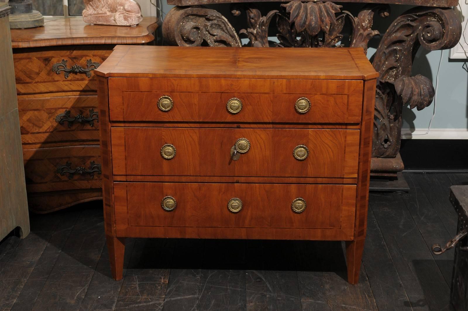 A Swedish period Gustavian 18th century three-drawer chest. This Swedish chest from circa 1780 features three dovetailed drawers with round harware with ring pulls. The keyholes are hidden behind the round escutcheons in the center. This Swedish