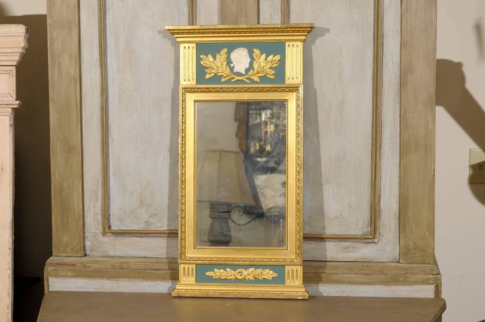 A Swedish neoclassical style gilded mirror with cameo and 