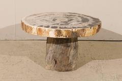 A Live-Edge Petrified Wood Pedestal Coffee Table w/Mostly Round-Shaped Top