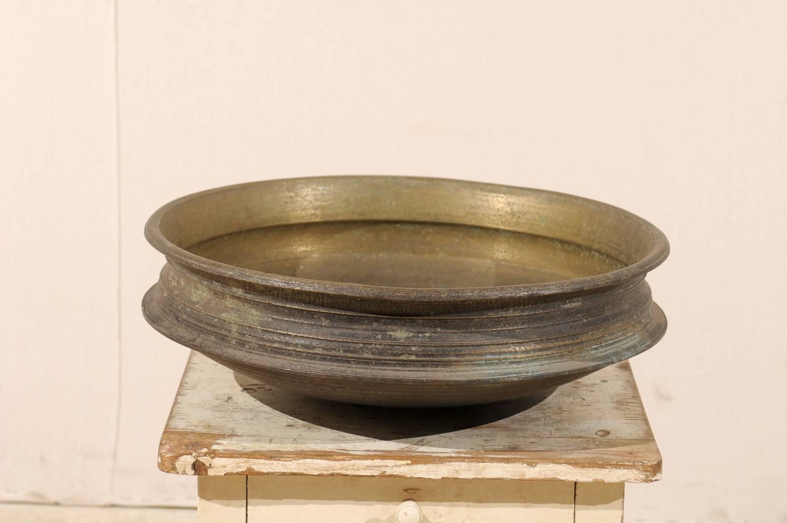 An Uruli vessel from Southern India. This uruli, from the early 20th century, is made of bell metal. Urulis are vessels which are circular in shape and shallow in depth, and were typically used in traditional cookware extensively used in southern