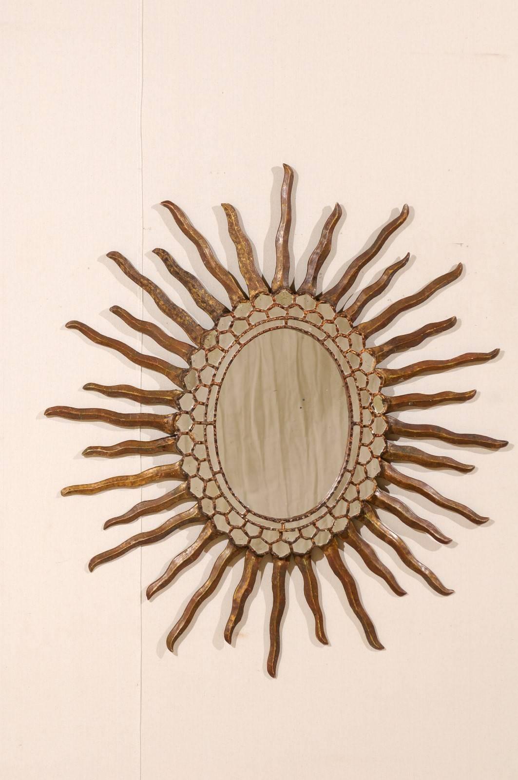 Spanish Oval Shaped Bronze and Gold Antiqued Sunburst Mirror, Intricate Surround In Good Condition In Atlanta, GA