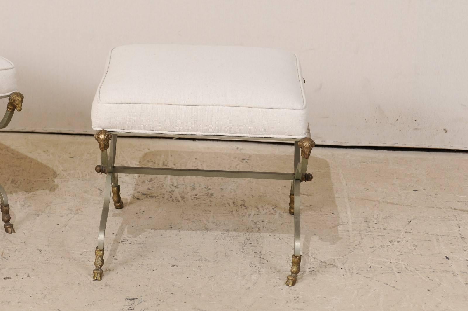 Metal Pair of French Upholstered X-Shaped Stools with Brass Ram Head Motif Accents