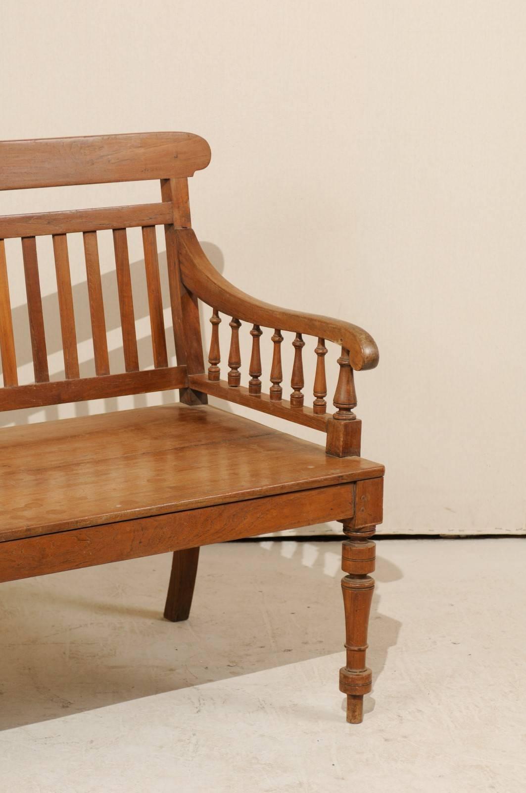 Carved British Colonial Style Teak Wood Bench with Slats on the Backrest & Turned Legs