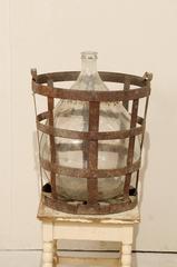 Mid-Century French Patinated Vintner Iron Basket with Demijohn Wine Bottle