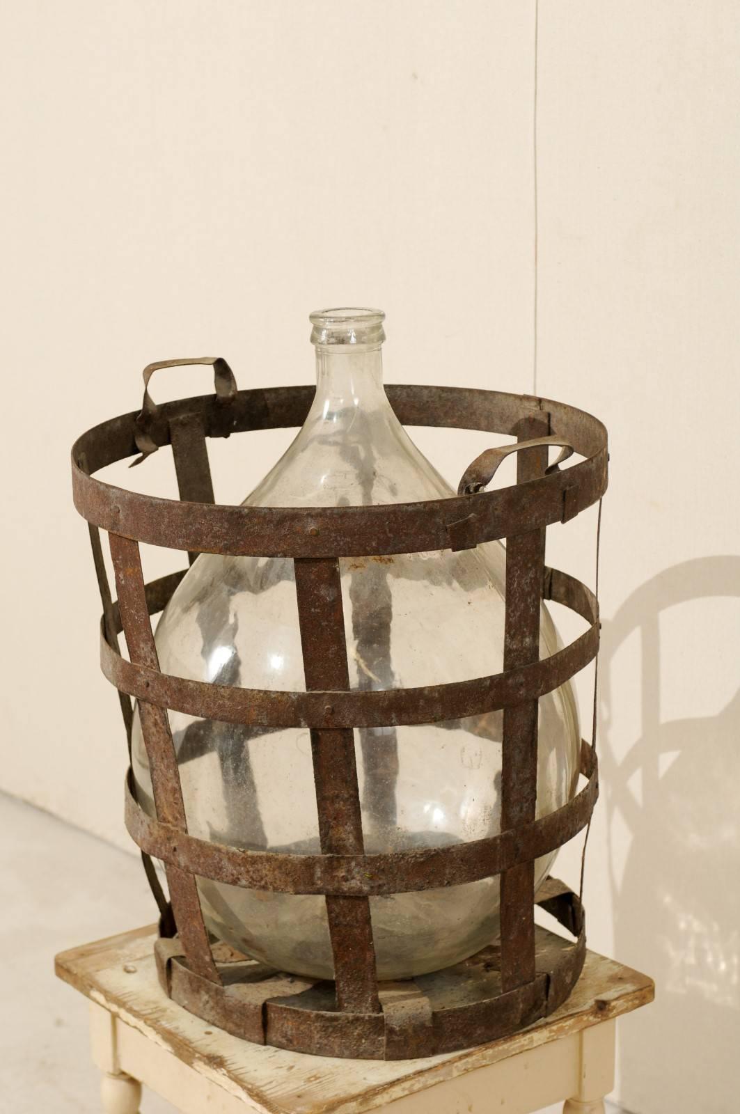 Glass Mid-Century French Patinated Vintner Iron Basket with Demijohn Wine Bottle