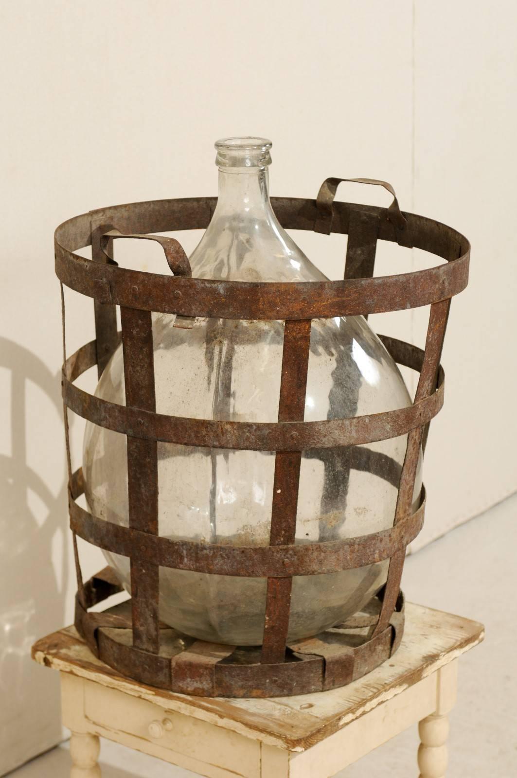20th Century Mid-Century French Patinated Vintner Iron Basket with Demijohn Wine Bottle