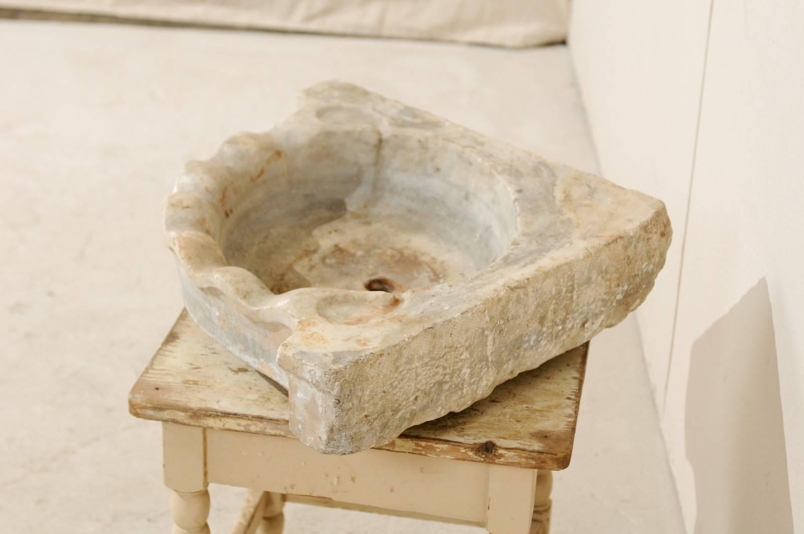 Carved 19th Century European Marble Corner Sink with Stylized Sea Shell Shape in Front