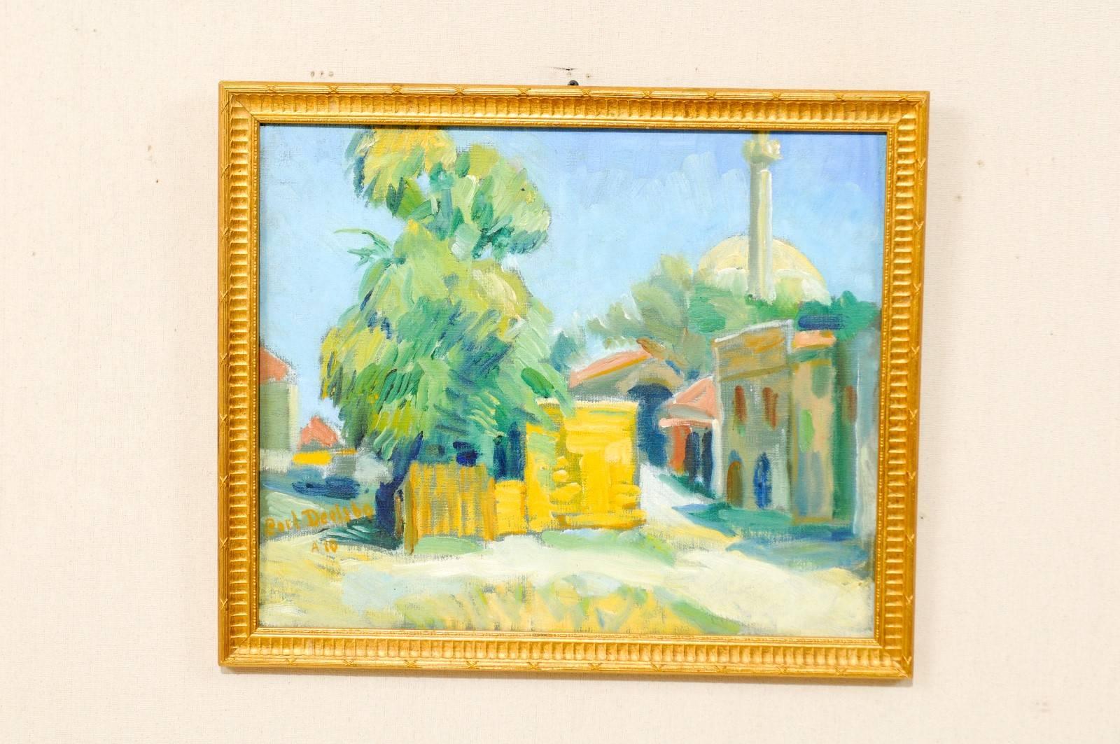 An oil painting by Swedish artist Carl Deelsbo (1892-1990). This is a lovely painting which depicts a Tunisian village and surrounding landscape. This painting is surrounded by a gold wood carved frame. Signed 