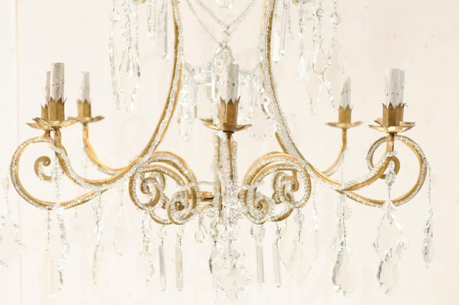 Italian Eight-Light Crystal and Gilded Iron Chandelier with Ornate Scroll Design 1