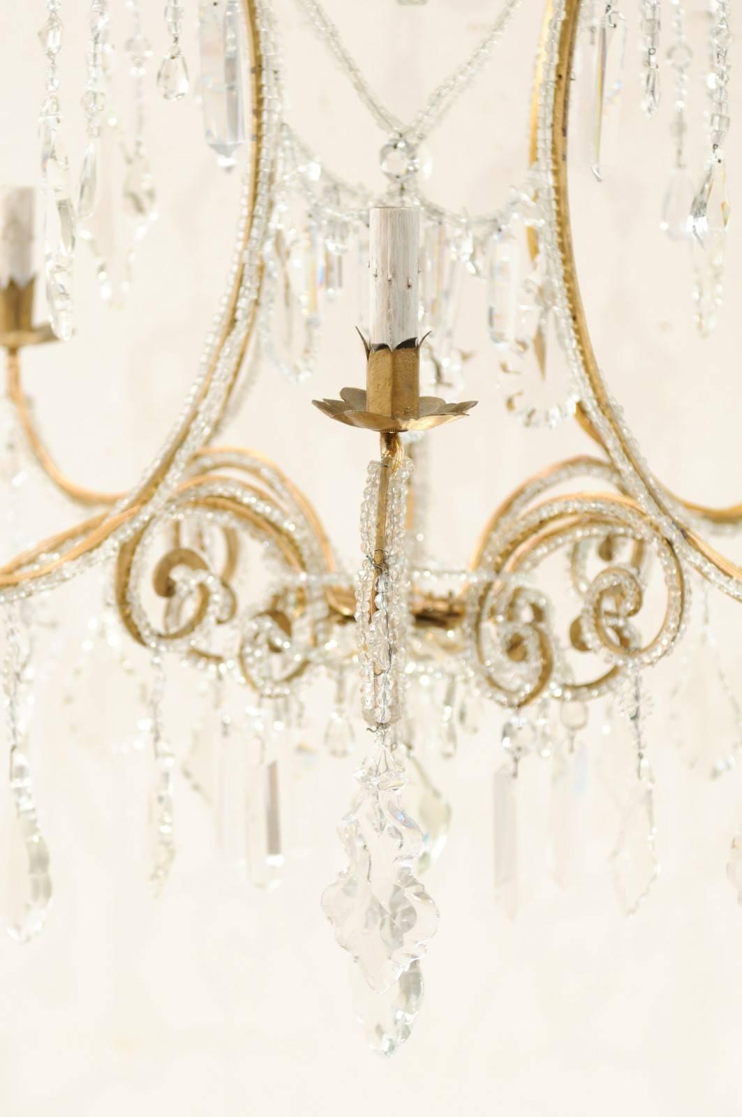 Italian Eight-Light Crystal and Gilded Iron Chandelier with Ornate Scroll Design 5