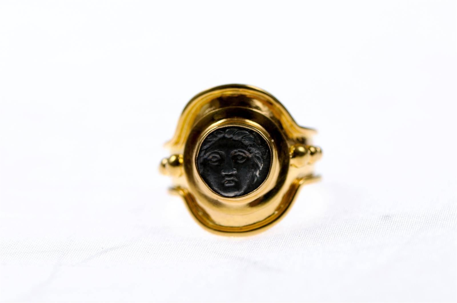 A 22-carat gold ring, featuring an authentic Greek coin of Apollonia Pontika of Thrace, AR Diobol, circa 5th-4th century BC. Reverse side of coin is an anchor, which is not visible. Size 8 ring.