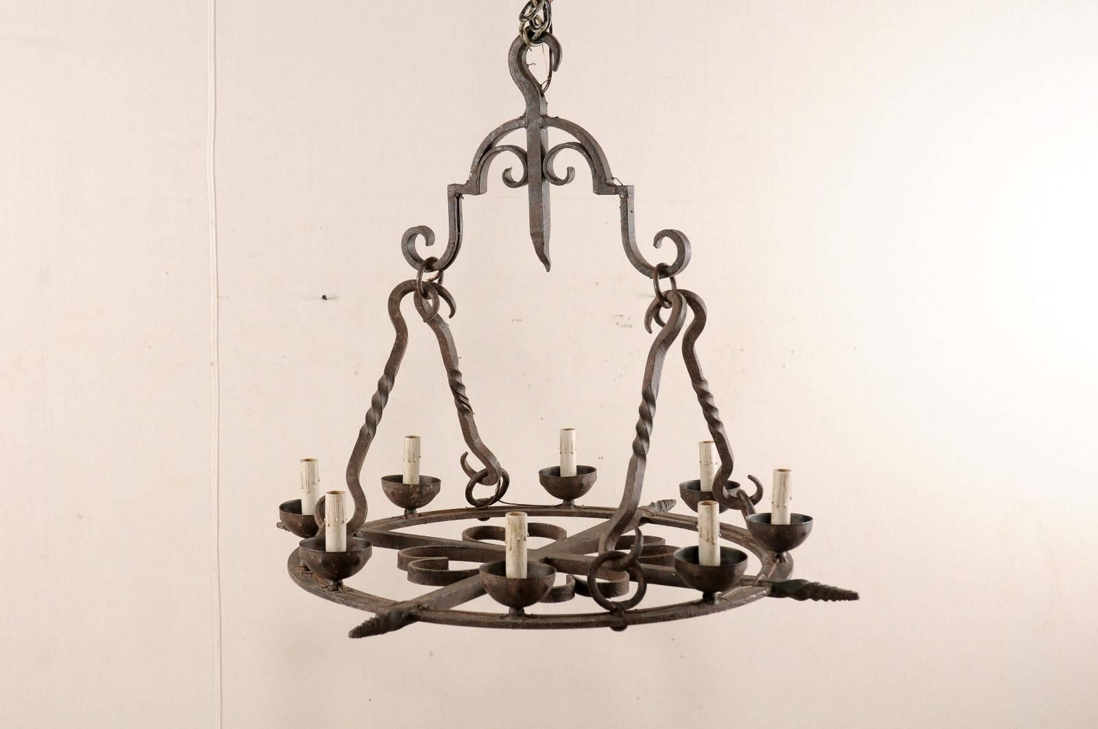 French Mid-Century Eight-Light Forged Iron Chandelier with Hooks and Scrolls In Good Condition For Sale In Atlanta, GA