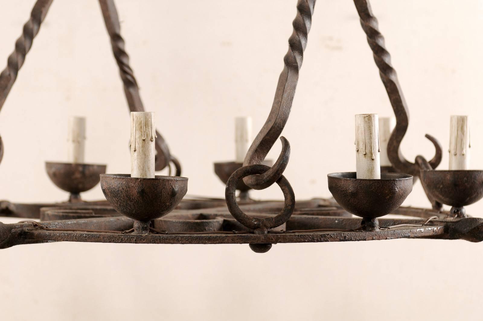 French Mid-Century Eight-Light Forged Iron Chandelier with Hooks and Scrolls For Sale 2