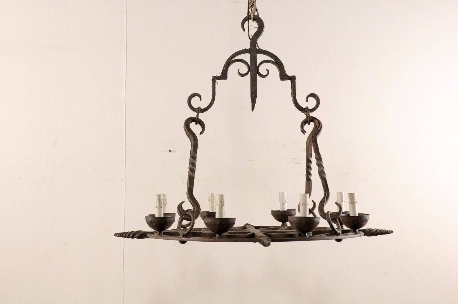 French Mid-Century Eight-Light Forged Iron Chandelier with Hooks and Scrolls For Sale 3