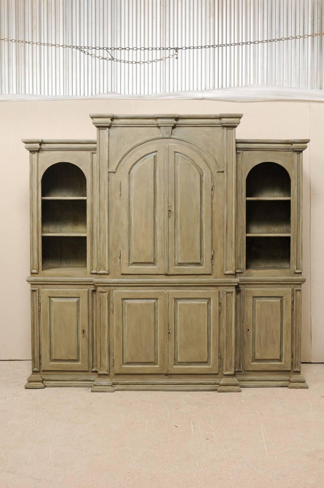 A large size Brazilian painted wood cabinet. This custom Brazilian cabinet has been constructed from old reclaimed wood. The cabinet features a larger mid-section which both steps up in height and steps out in depth from its flanking counterparts.