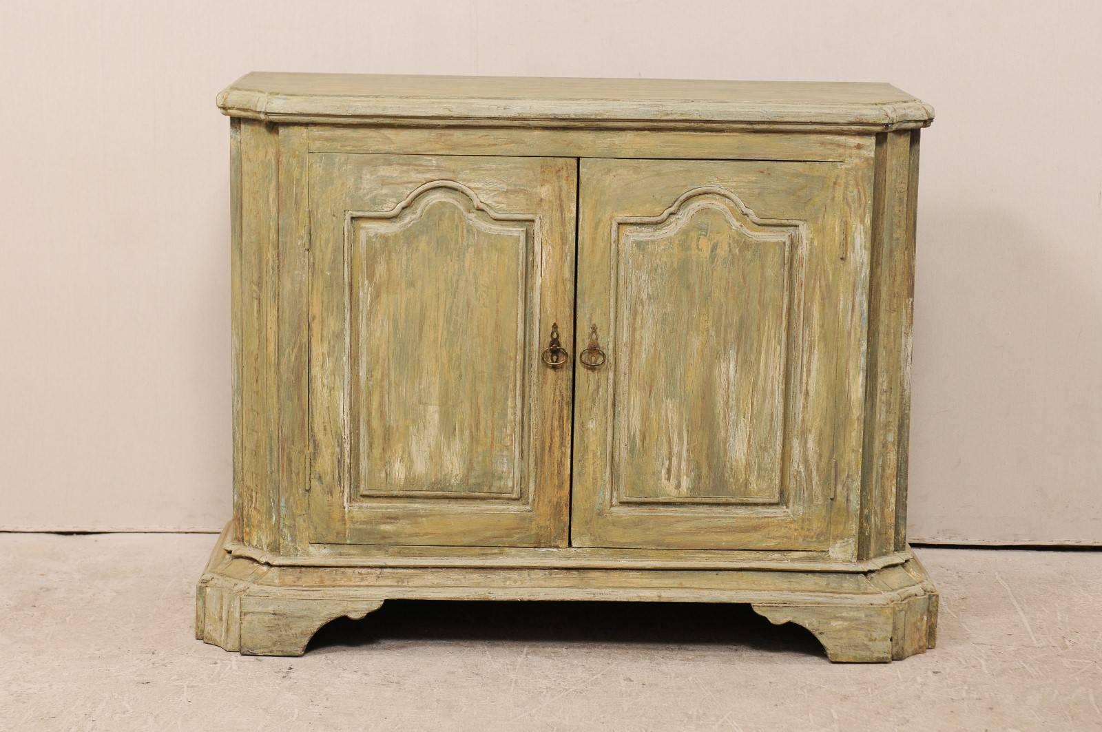 A pair of custom American two-door painted wood buffet console. This pair of Italian style custom buffet cabinets have been made of old reclaimed doors and wood. These cabinets each feature two doors, concave and canted side posts (with top buffet