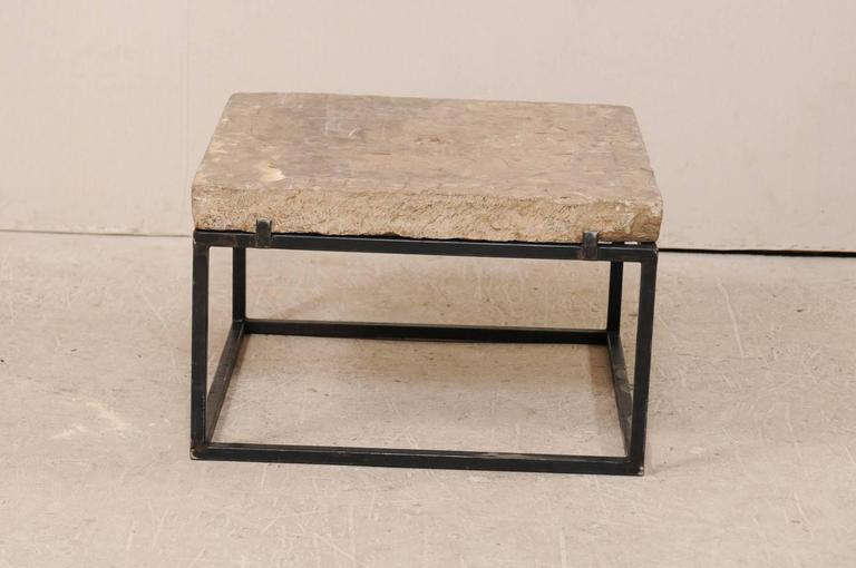 18th Century Spanish Carved Stone Top Coffee Table With Sleek Black 18th Century Spanish Carved Stone Top Coffee Table With Sleek Black Metal Base In Good Condition