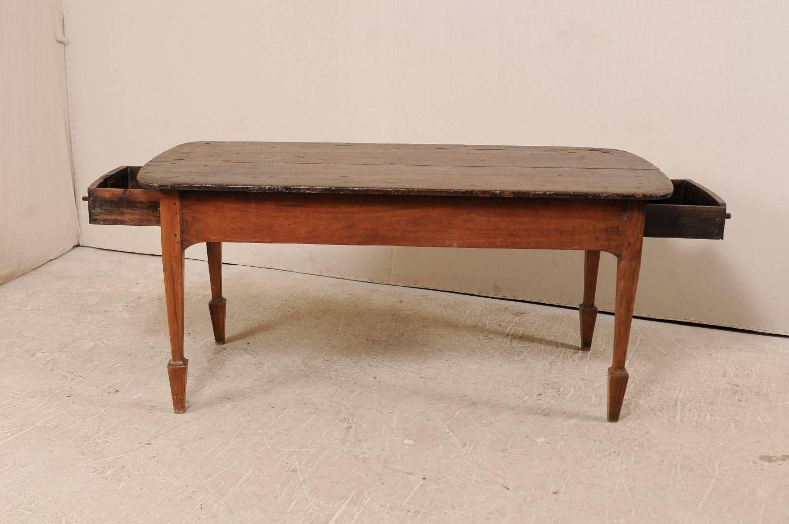 Early 20th Century Brazilian Peroba Wood Table with Two Drawers and Spaded Feet In Good Condition In Atlanta, GA
