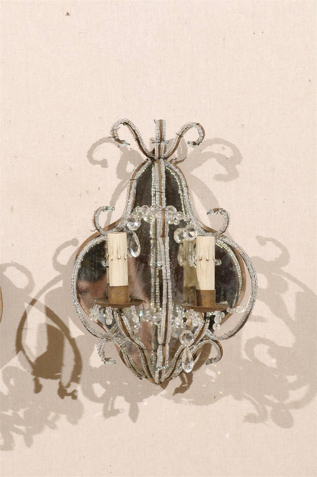 20th Century Pair of Italian Mirrored Sconces with Elegant Beaded Armature and Scrolls