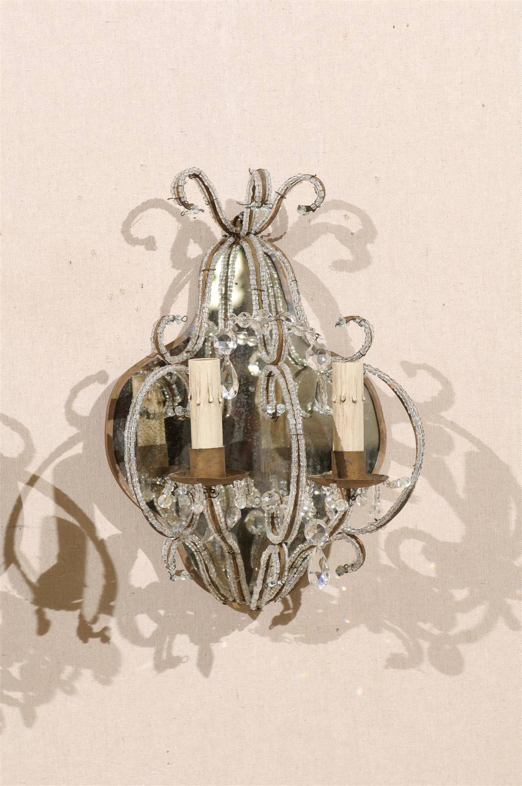 Metal Pair of Italian Mirrored Sconces with Elegant Beaded Armature and Scrolls
