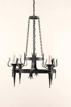 French Vintage Four-Light Black Iron Chandelier with Torch Shaped Arms