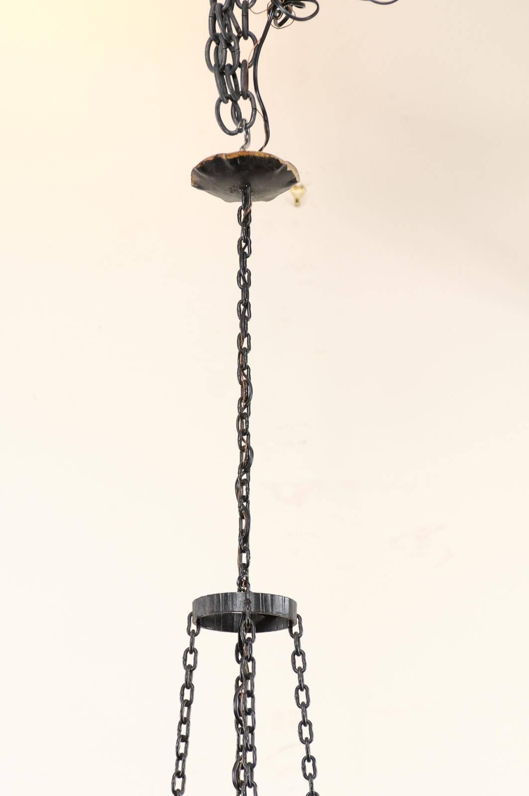French Vintage Four-Light Black Iron Chandelier with Torch Shaped Arms For Sale 2