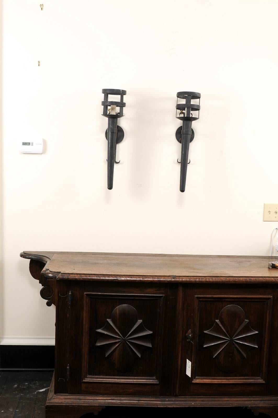20th Century Pair of Tall and Narrow Iron Torch Single-Light Wired Black Sconces