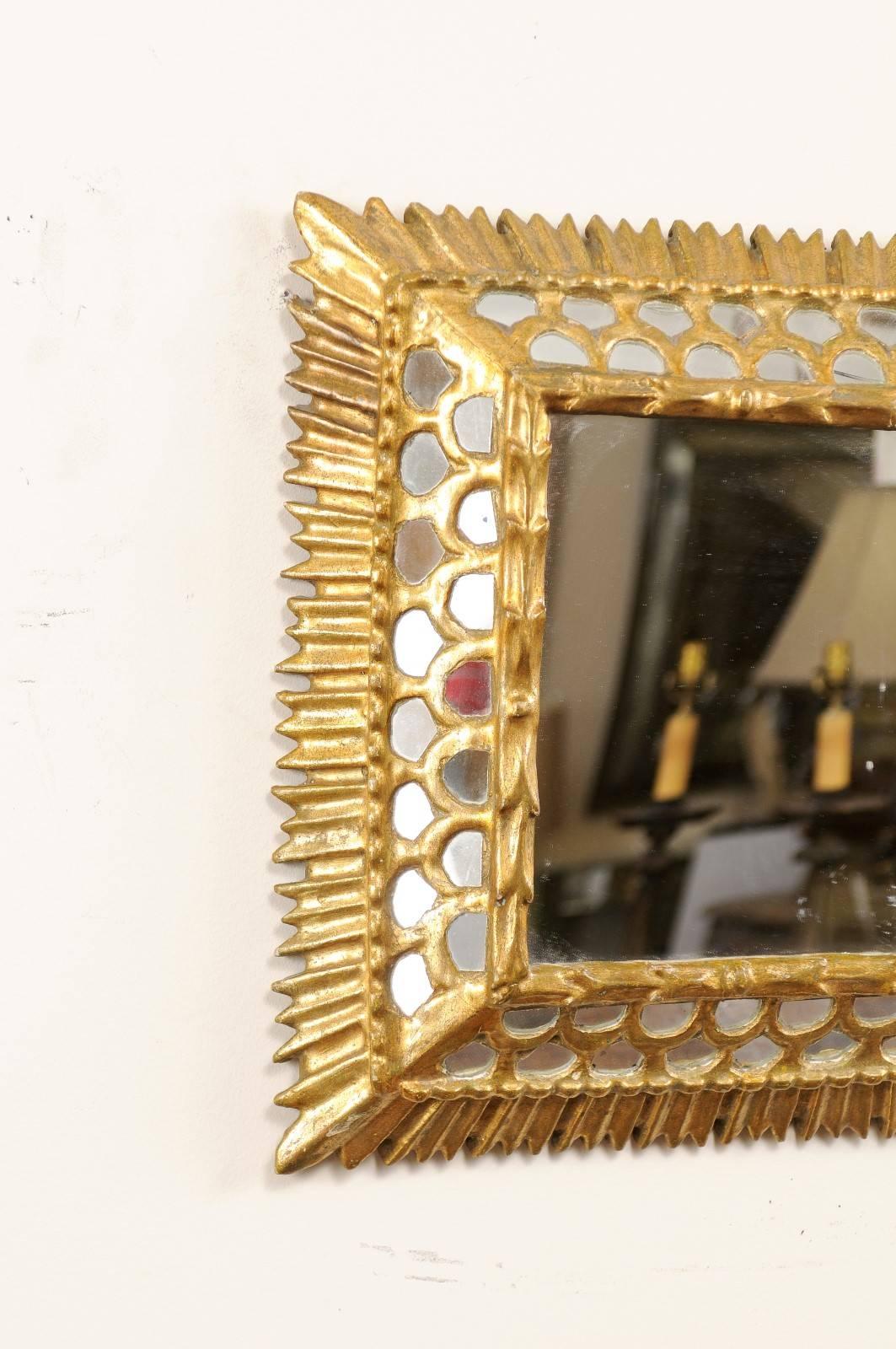20th Century Small European Gilded Mirror with Raised Centre and Honeycomb Pattern Surround