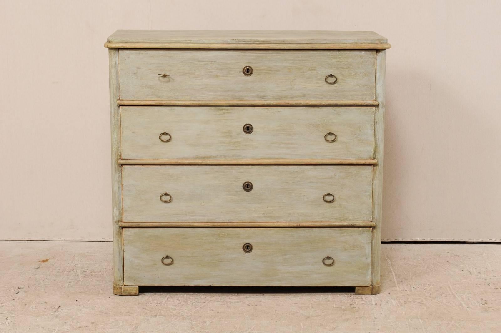 A Swedish 19th century painted wood four-drawer Karl Johan chest, circa 1840-1850. This antique Swedish chest features nice cleans, a raised top with rounded corners and is raised on wrap around feet. There are four dovetailed drawers, each adorn