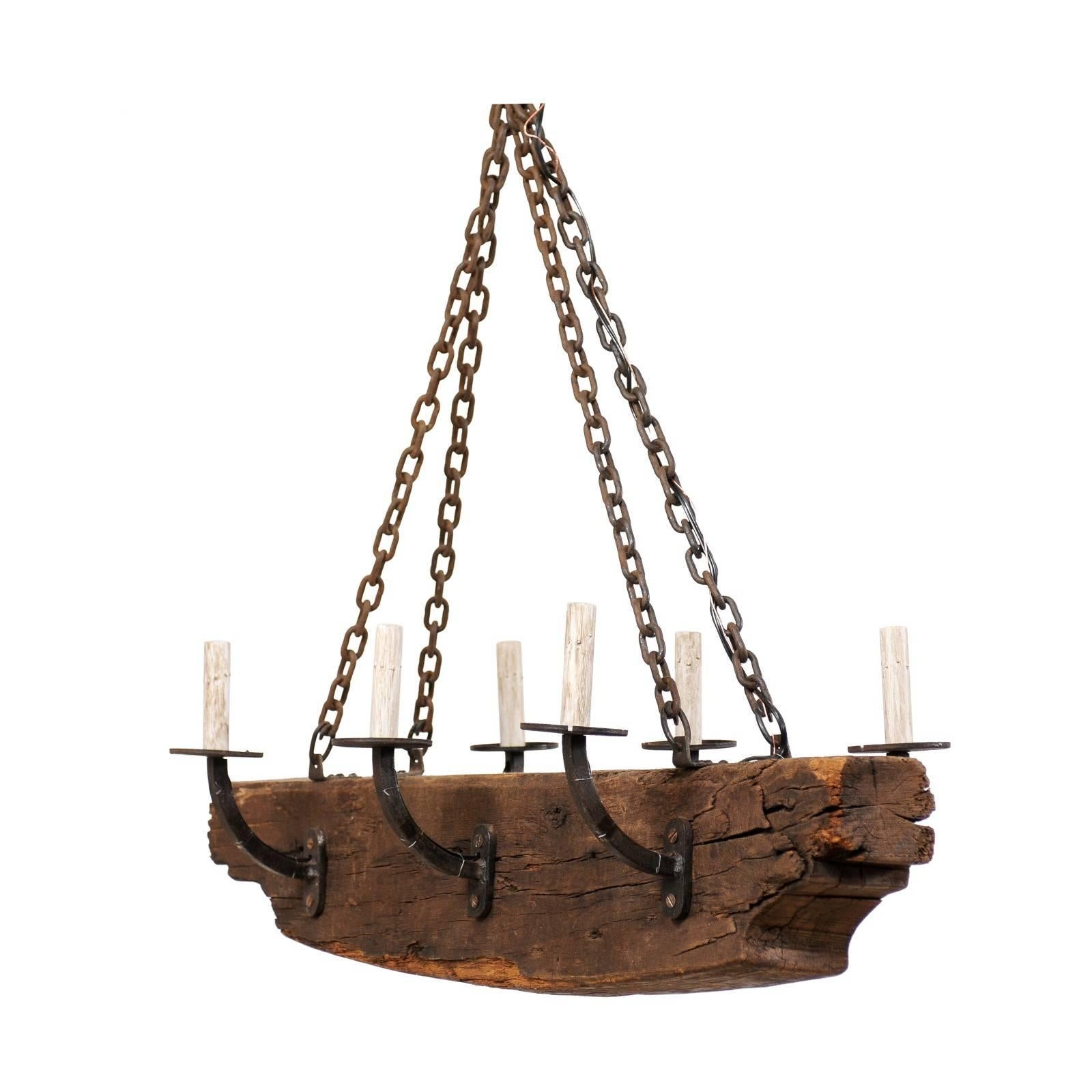 French Rustic Wood Beam Chandelier with Six Forged Iron Arms, Mid 20th C. For Sale