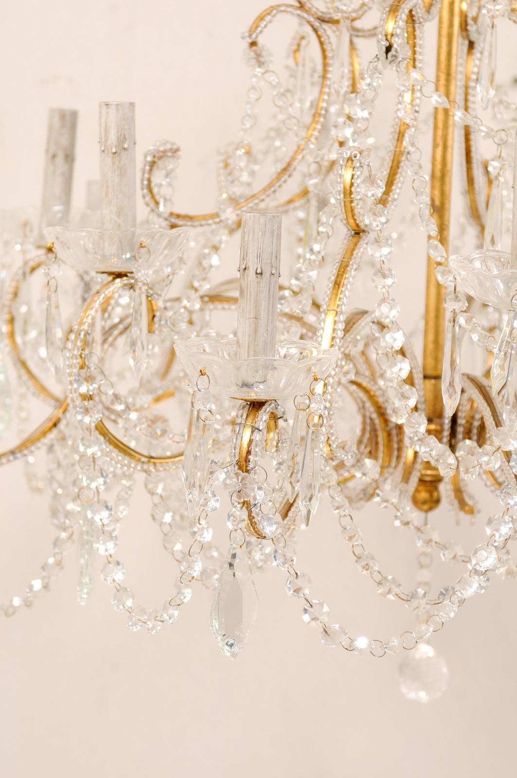 Metal French Mid-20th Century Twelve-Light Crystal Chandelier with Gilded Iron Arms