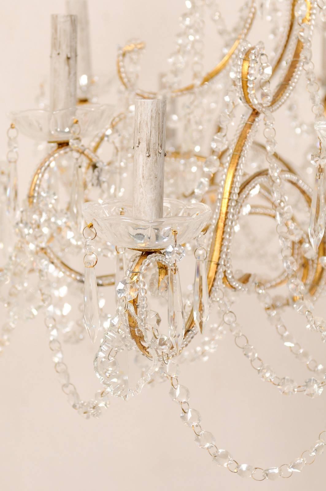 French Mid-20th Century Twelve-Light Crystal Chandelier with Gilded Iron Arms 5