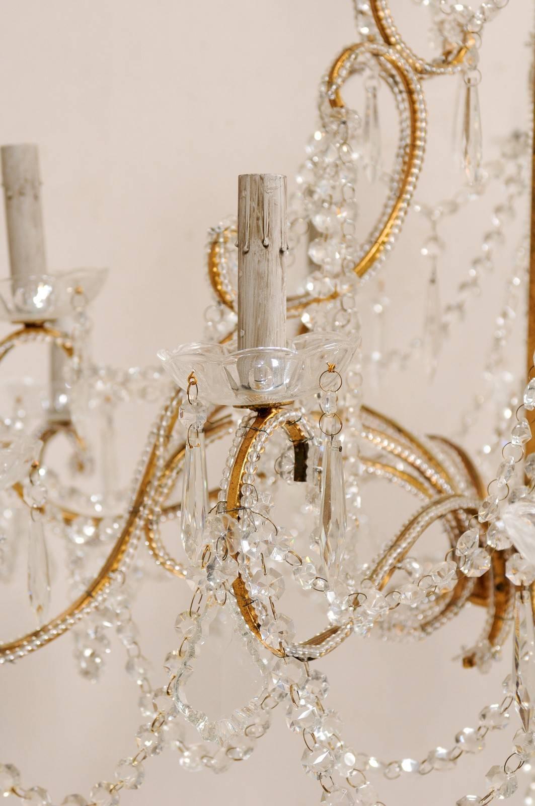 French Mid-20th Century Twelve-Light Crystal Chandelier with Gilded Iron Arms 4