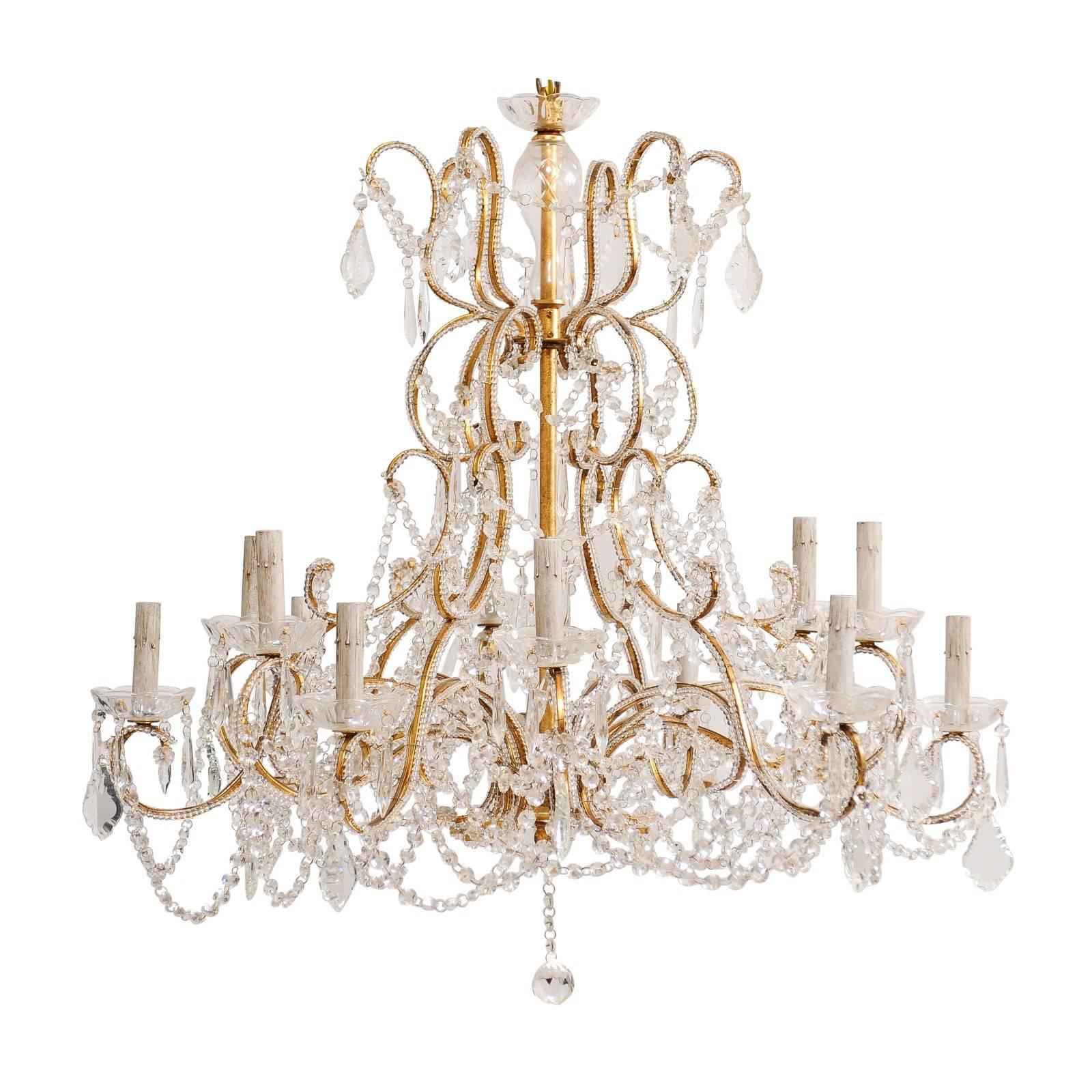 French Mid-20th Century Twelve-Light Crystal Chandelier with Gilded Iron Arms