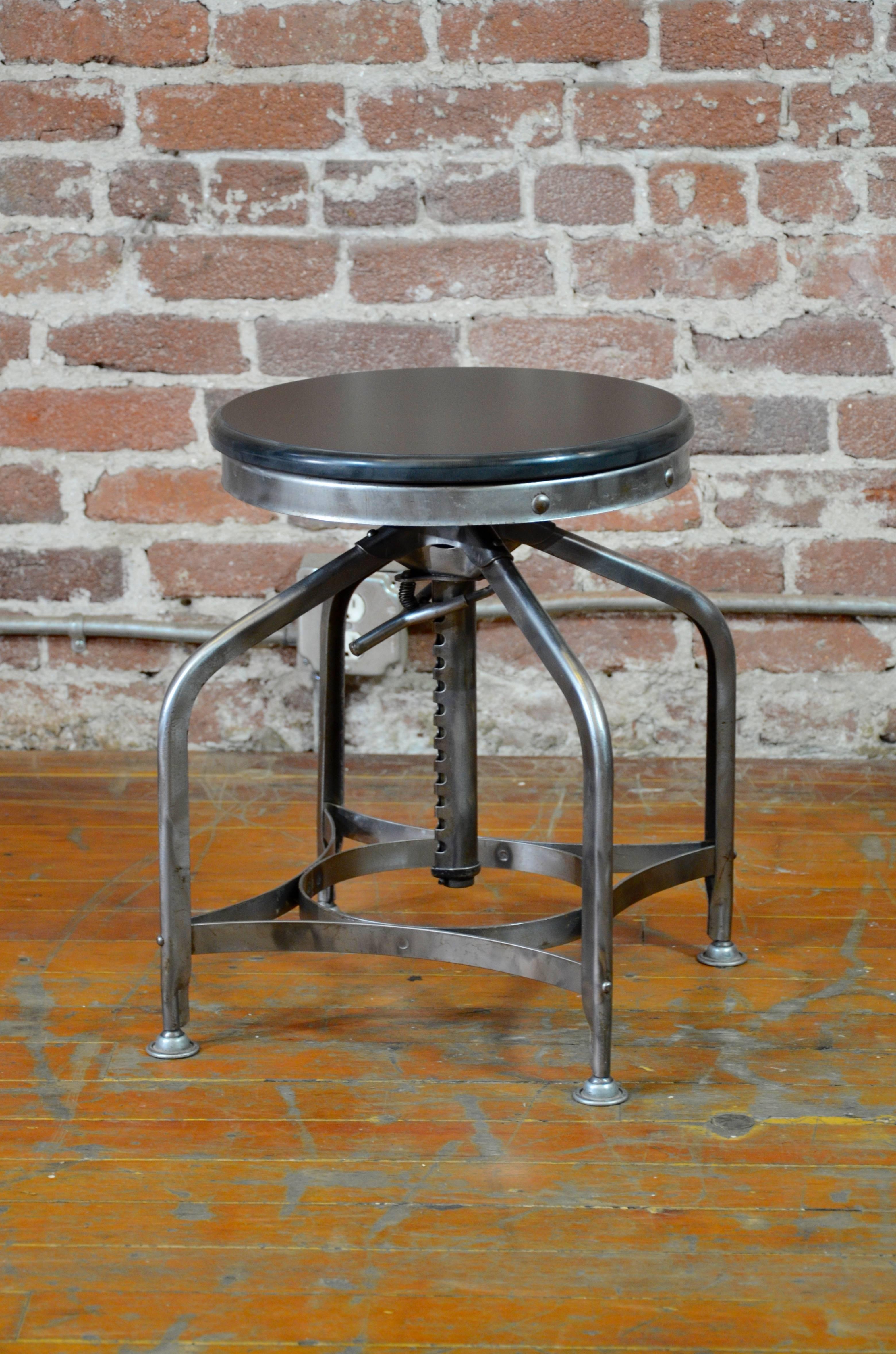 Handsomely authentic collection of polished steel lab stools by Toledo. These are adjustable from 19.5