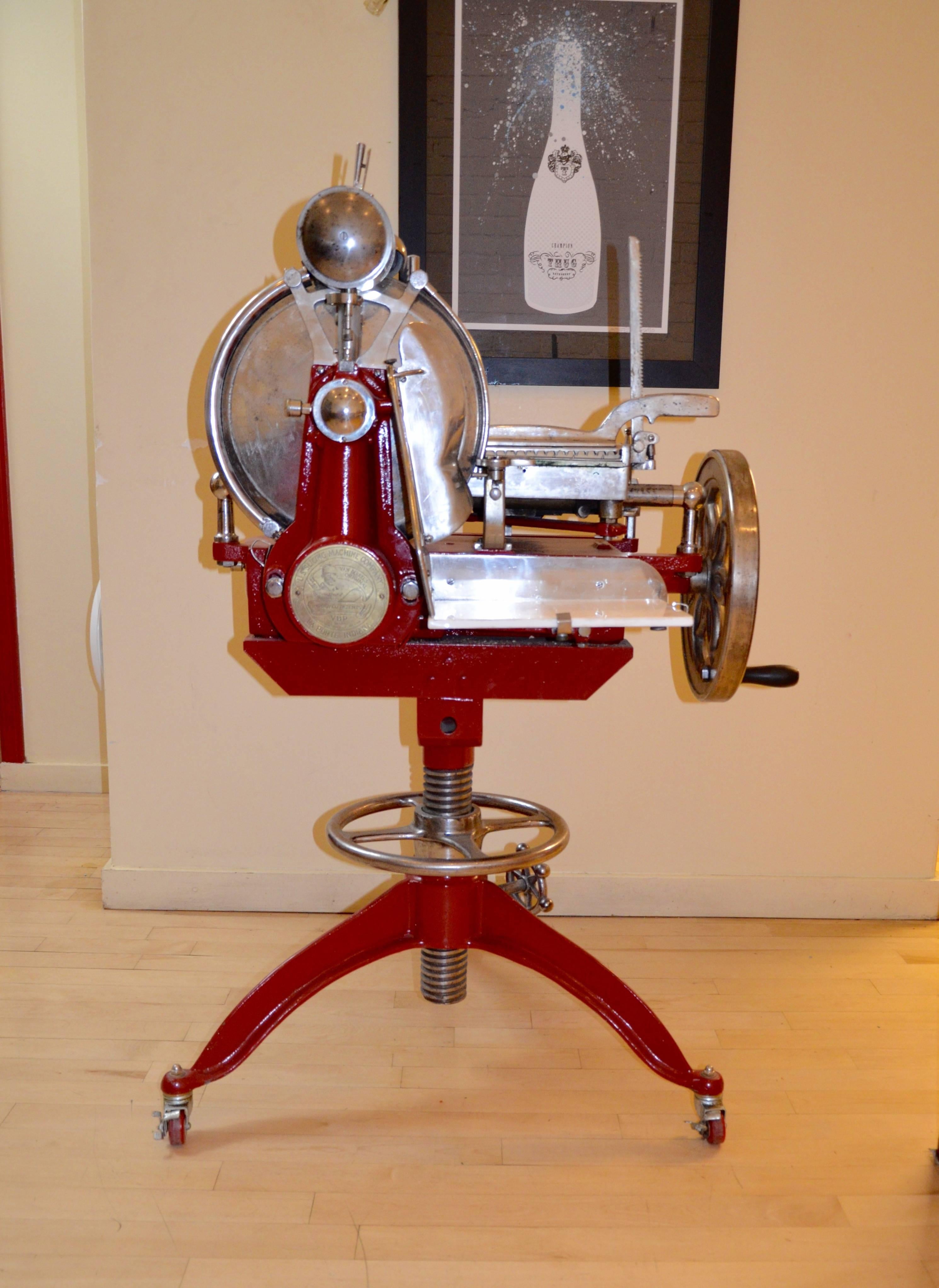 Made by the US Slicing Machine Comapany, This manual slicer is as beautiful as it is functional. This has been expertly restored, with the working parts polished, and the base and body have  a bold red powder coat.