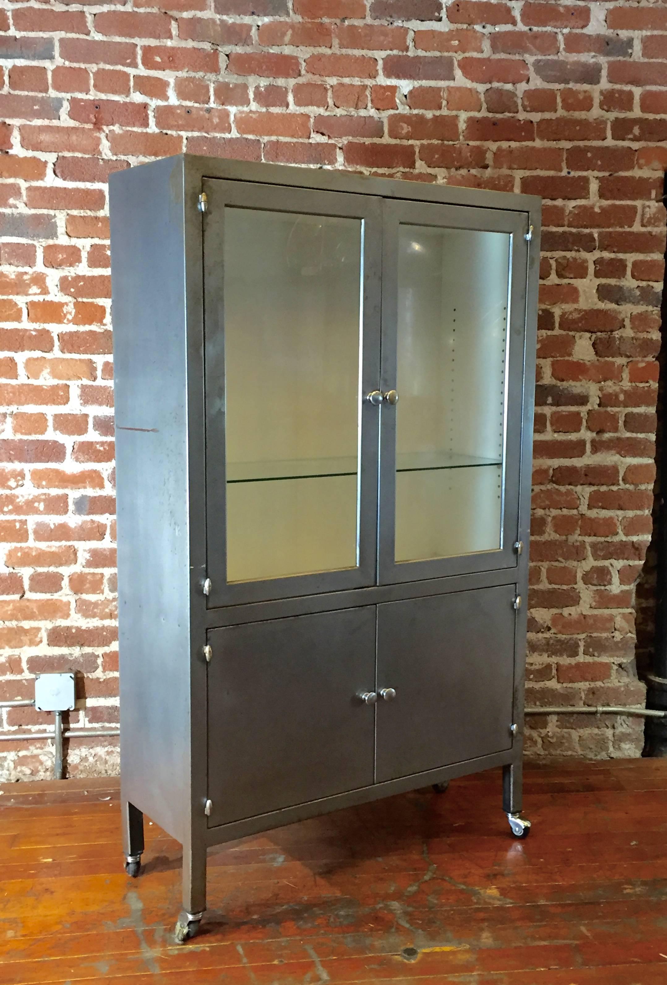 This handsome steel medical cabinet features an enameled white interior, nice heavy gauge steel, and old school bullet hinges.
 