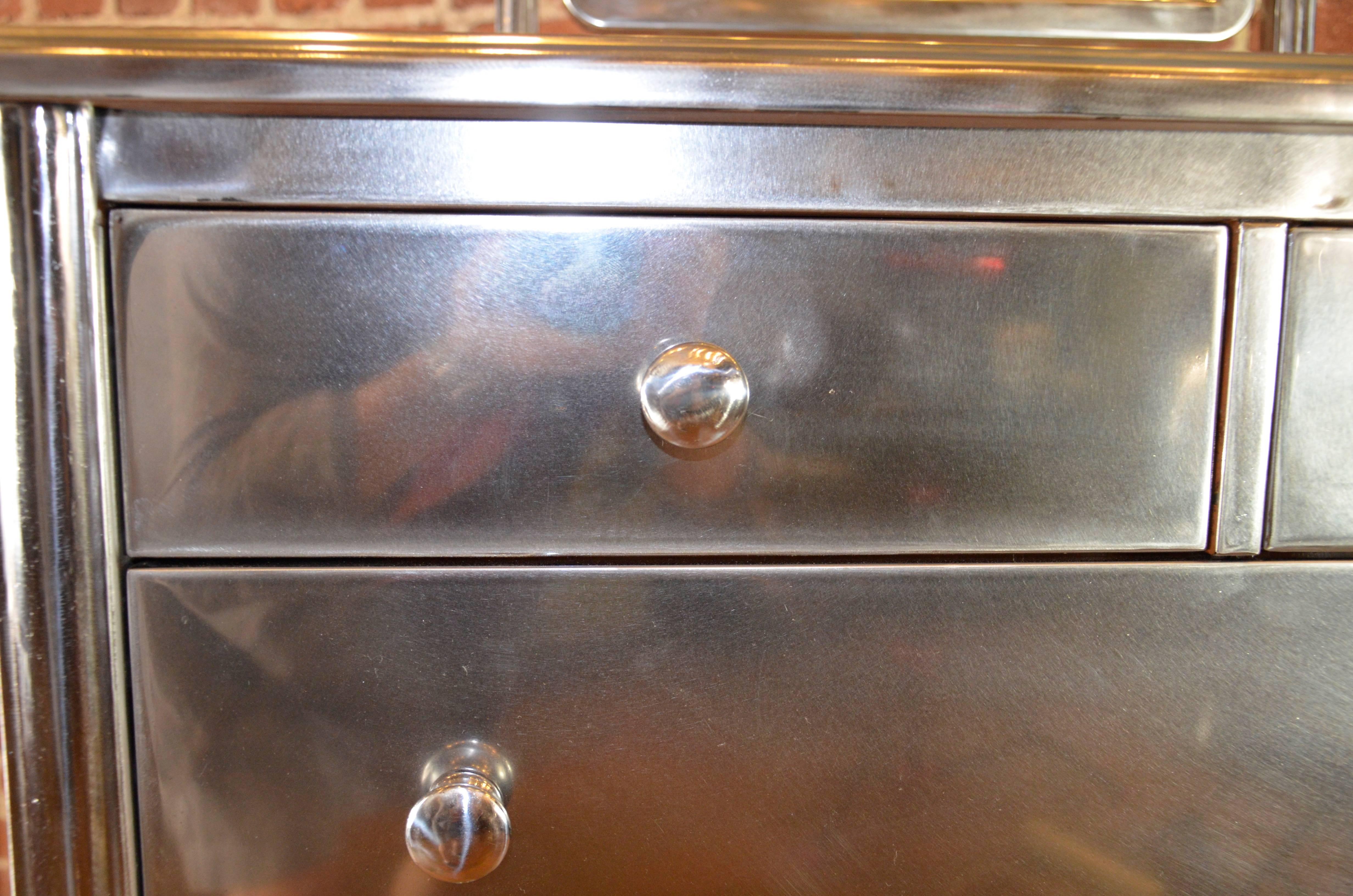 American Pair of Polished Steel Highboy Dressers by Simmons For Sale