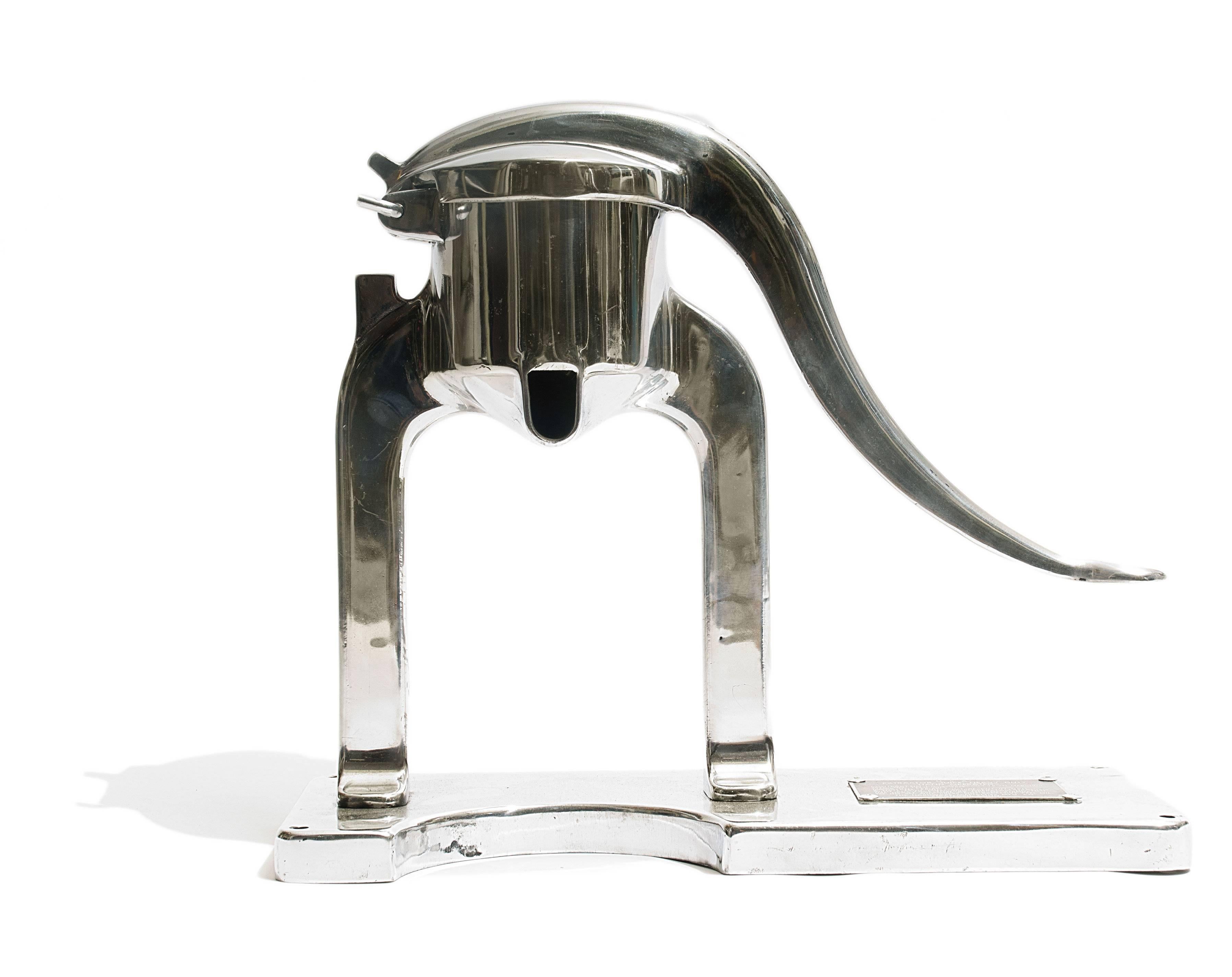 Industrial juicer from the hardware specialties Mfg. Co. This high quality manual appliance has a hand polished aluminum finish.