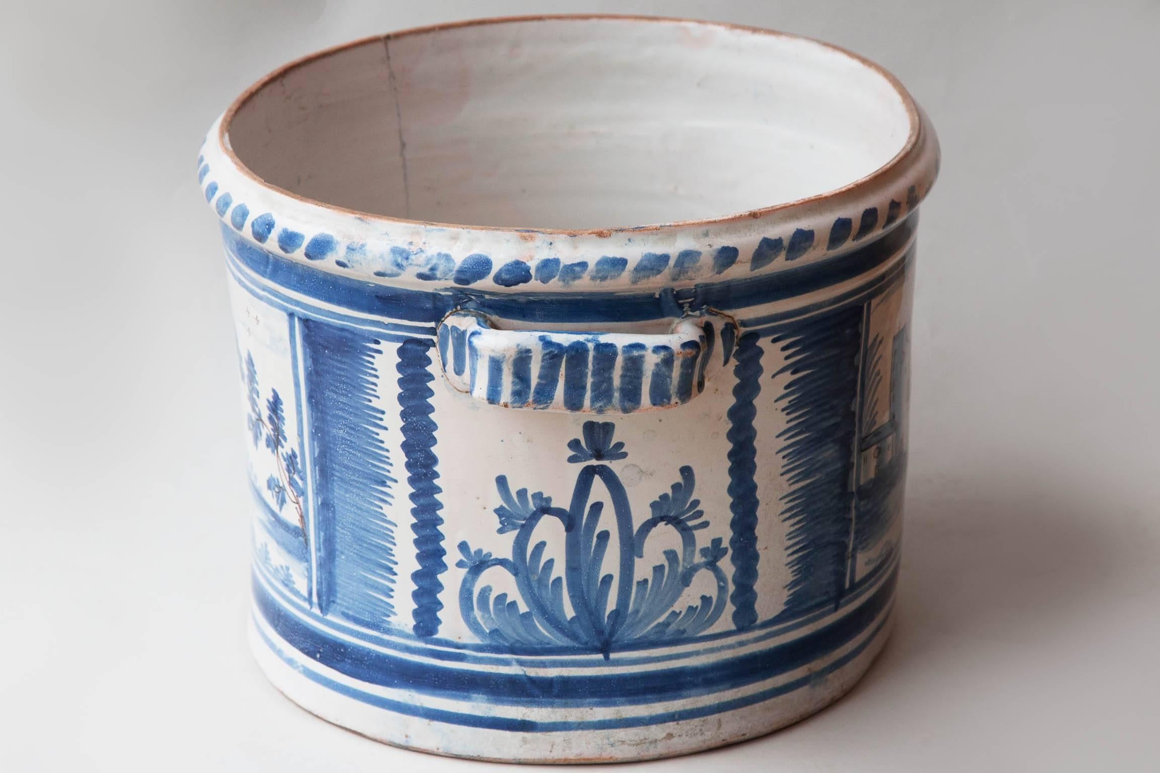 Decor de camaieu bleu representing the same view of a village on both sides. Nevers, France c.1800.

It was due to Louis XIV that Nevers became celebrated for the production of faïence. Towards the end of the 16th century he bought Augustin
