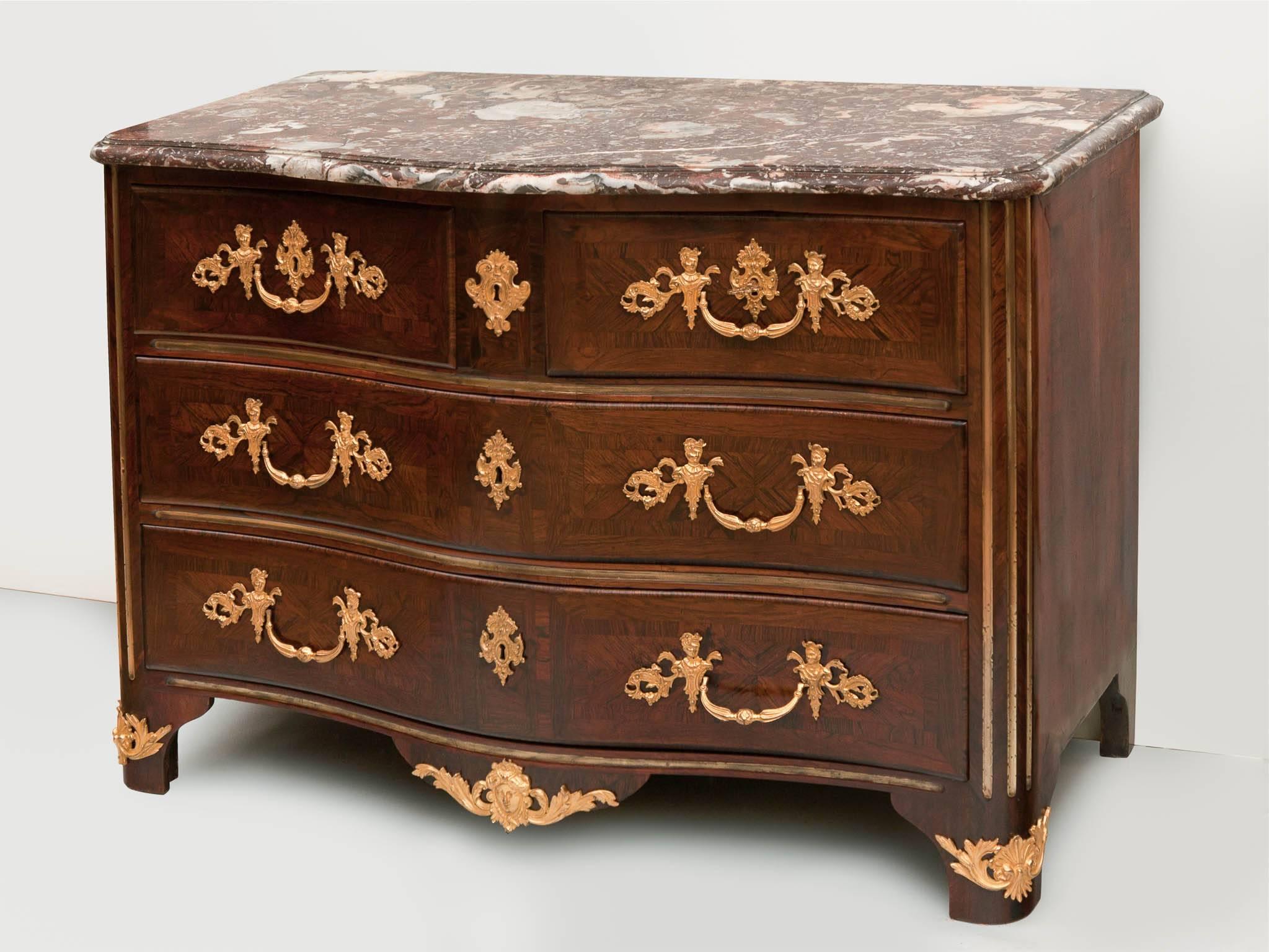 Serpentine fronted Regence commode. Rosewood parquetry veneer with gilt bronze mounts, handles & escutcheons, original locks with one key. Shaped red veined Pyrenean marble over two short drawers and two long drawers. the sides with brass