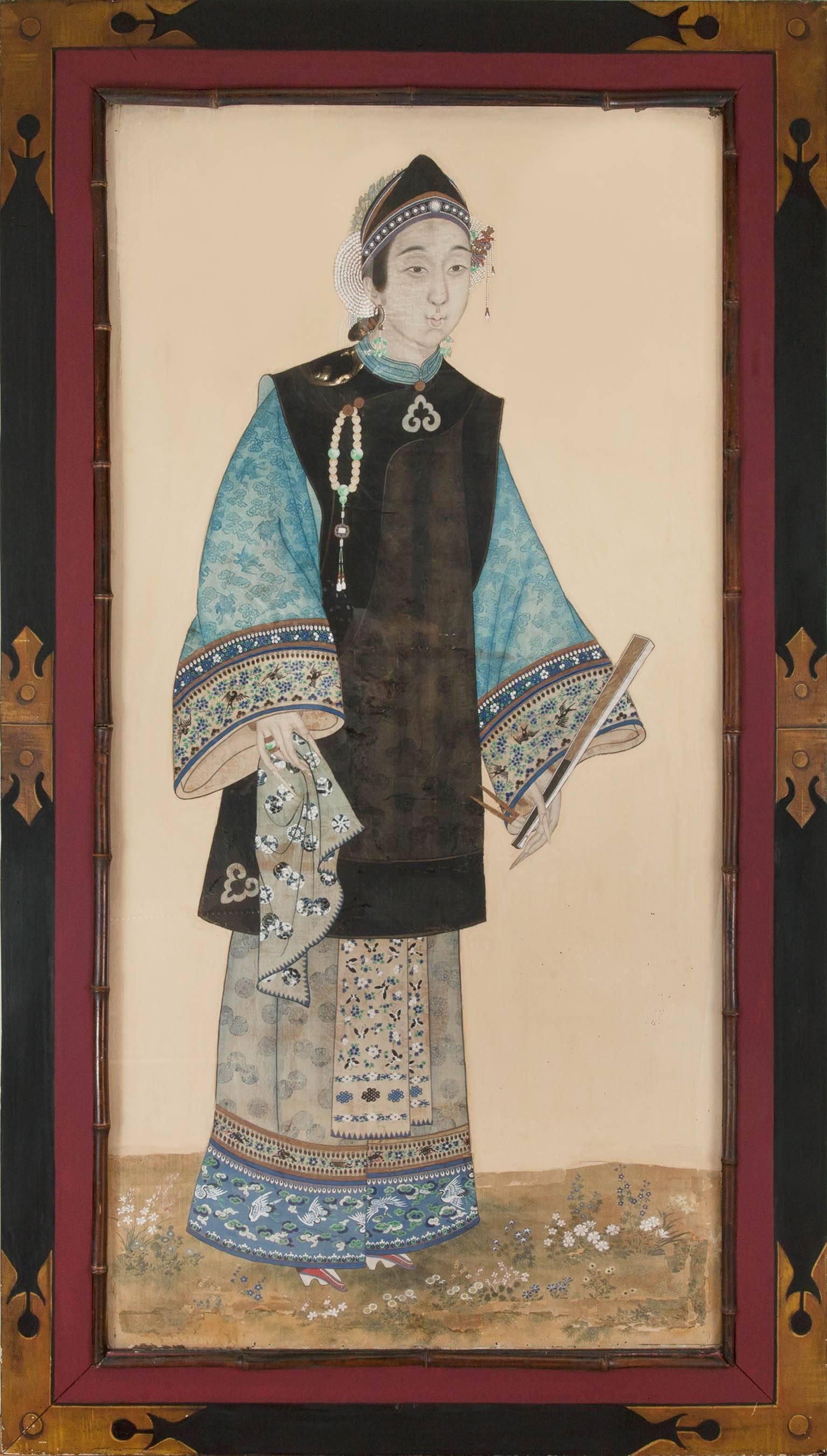A pair of mid-19th century Chinese Portraits. The two figures standing on a base of finely painted flowers, their costumes with minute detailing of flowers
butterflies and decoration in the Chinese taste. The man wears a decorated black tunic with