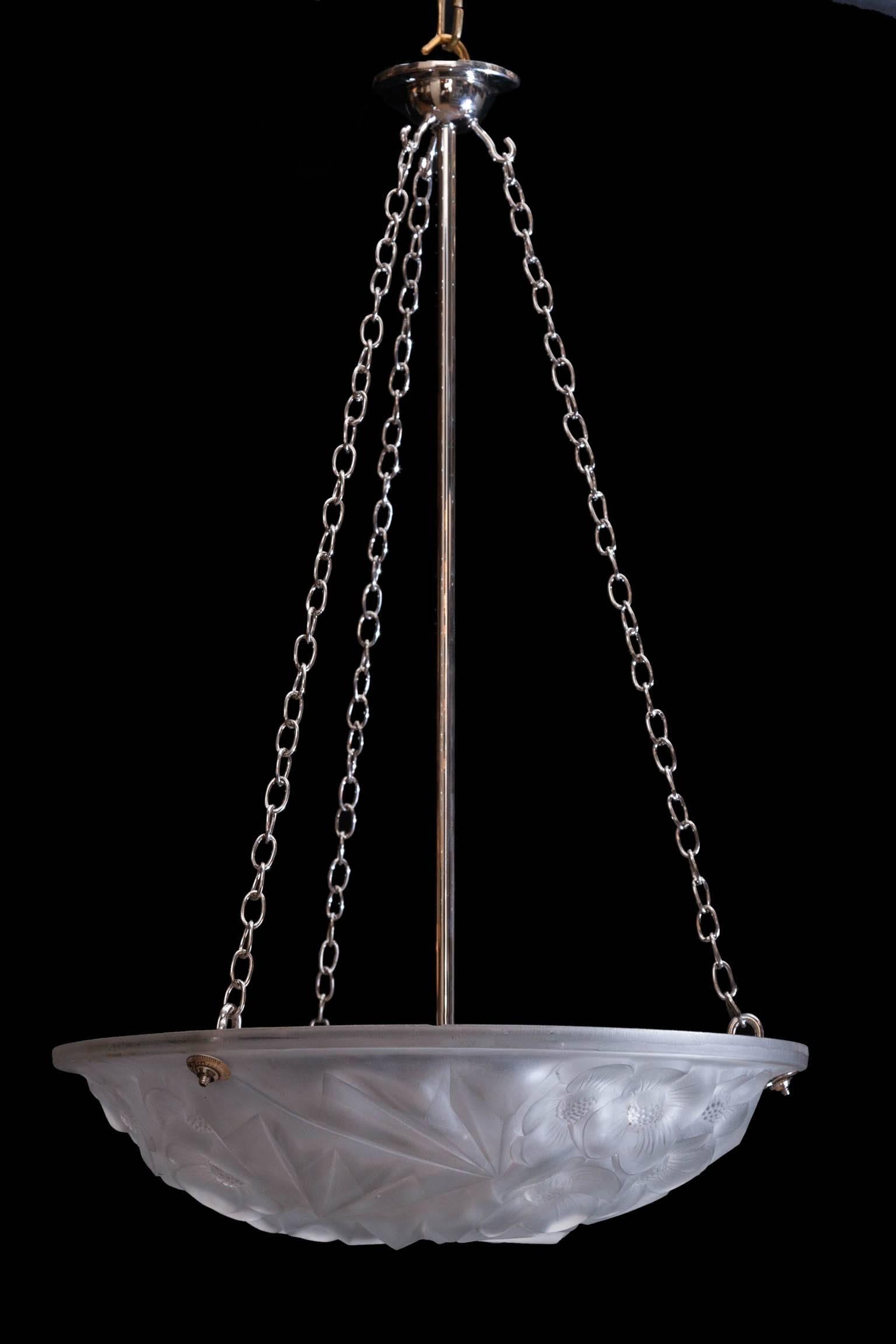 Moulded glass dish light hanging on three nickel chains from a ceiling hook, Decorated with  flowers and electrified for the UK with a central nickel rod and chain. France circa 1930

We are members of LAPADA and CINOA.

Re-electrification for non
