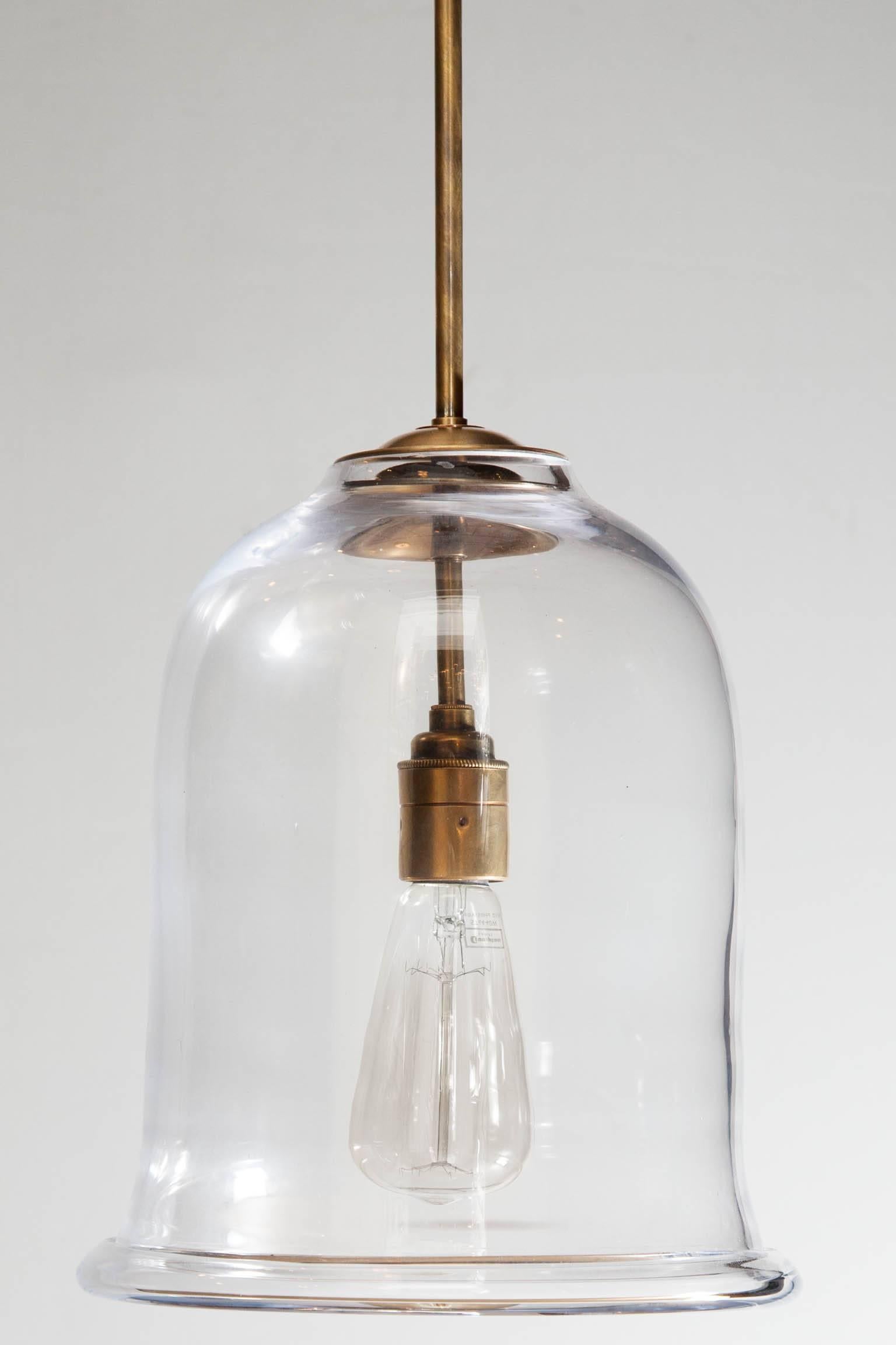 Contemporary bell jar lantern with antiqued brass mounts and fittings in the Industrial style. 
Currently electrified for the UK.
Height: 31 cm (12¼