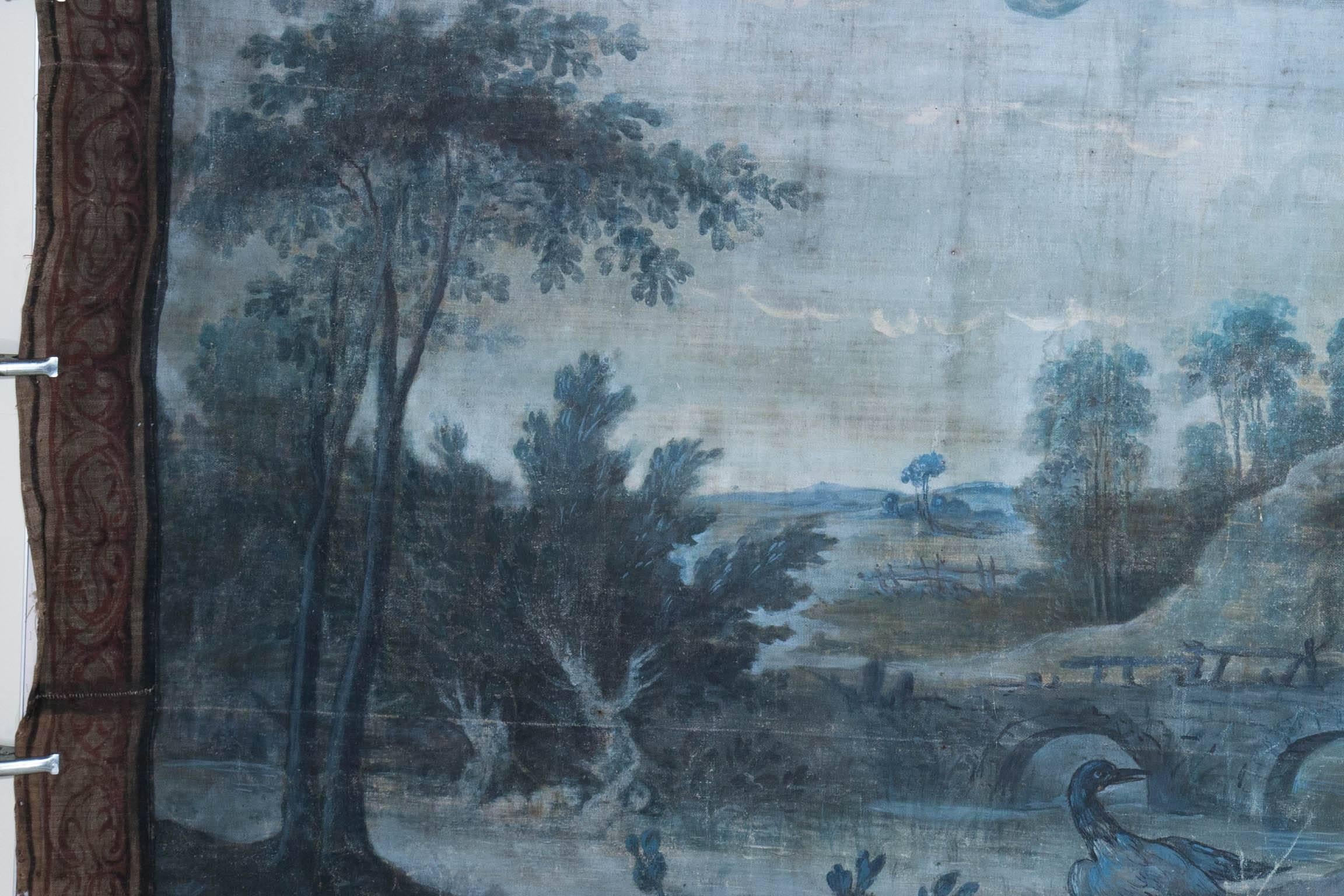 Painted to look like tapestries, with decorative borders, these paintings would have been part of the decoration in a large room, fixed directly to the walls within the panelling which would have surrounded them. Painted in greens and blues they are