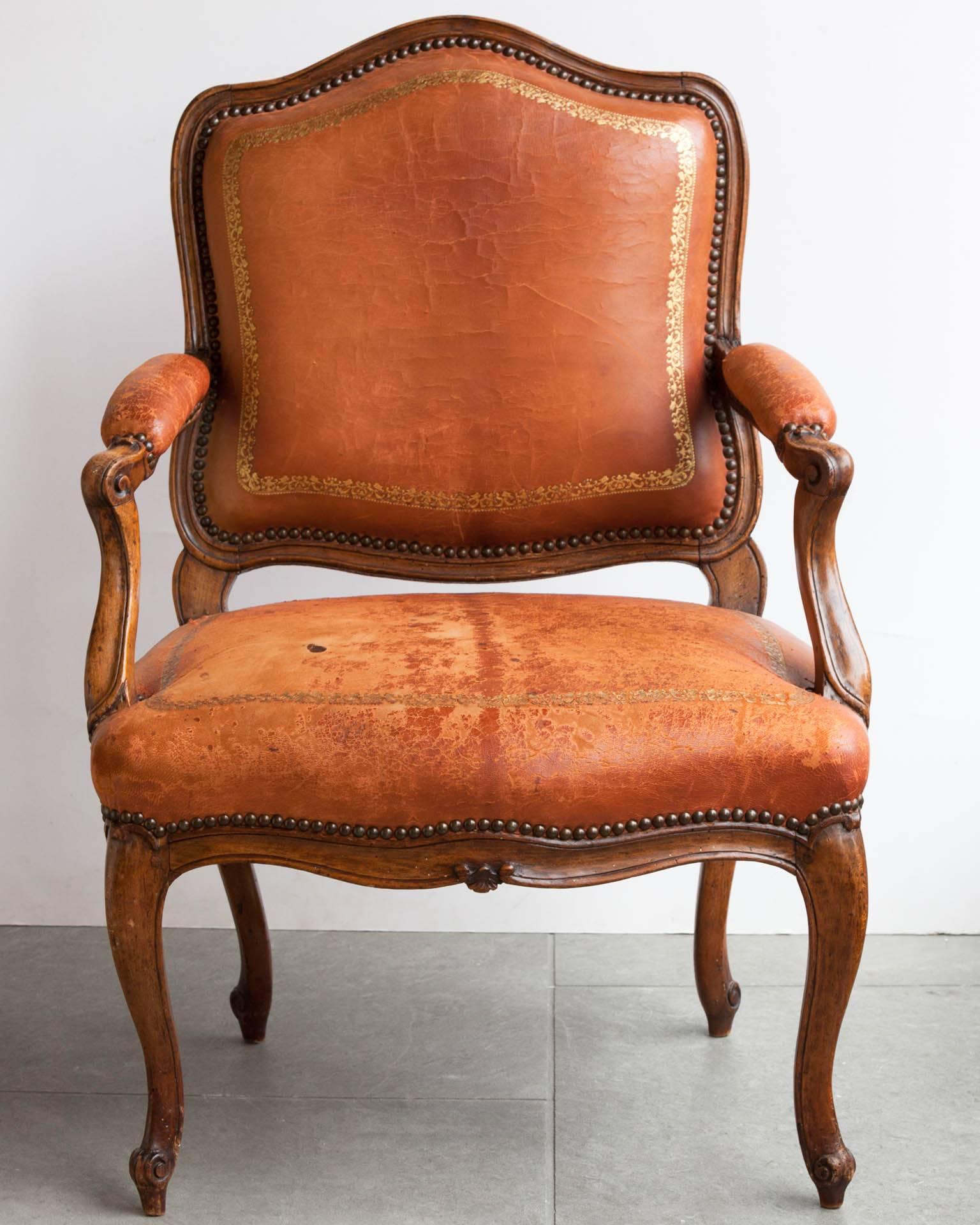 Mid-18th century carved beech armchair with curved legs terminating in carved scrolls. Upholstered in tan leather with gold tooling, in worn condition. 
Stamped by the maker 'G.Sene'.

We are members of LAPADA and CINOA.